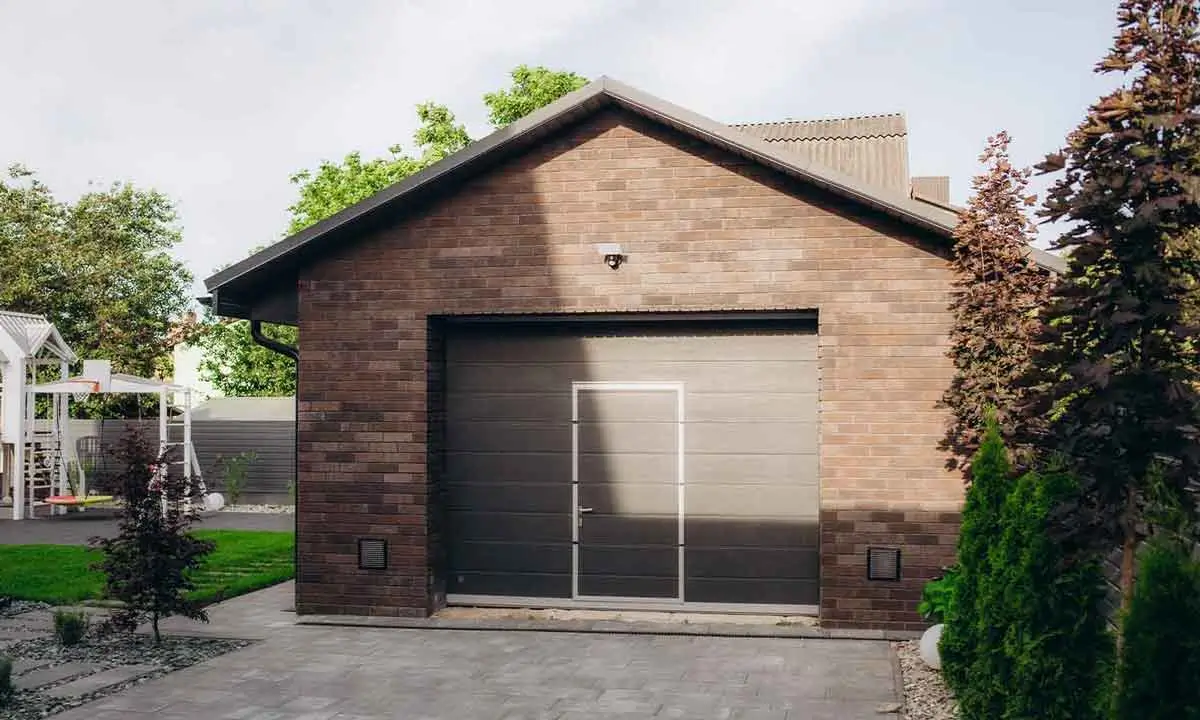 Home 4 A sleek, contemporary garage door with a pedestrian entry, illustrating the premium designs showcased by a garage door marketing agency