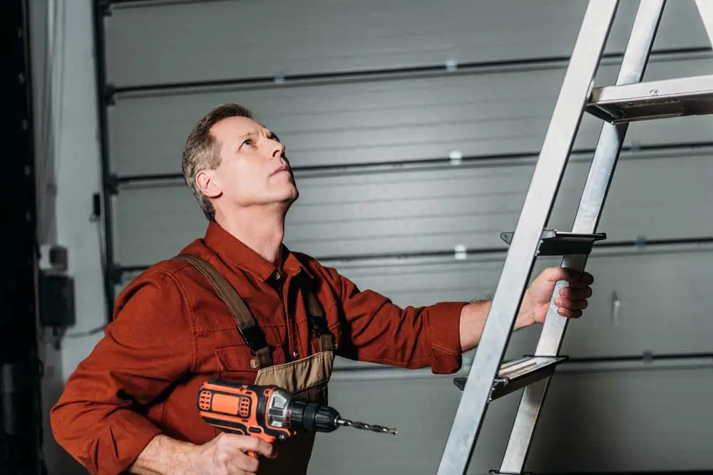 Garage door repair specialist on the job client acquired through a ppc company campaign