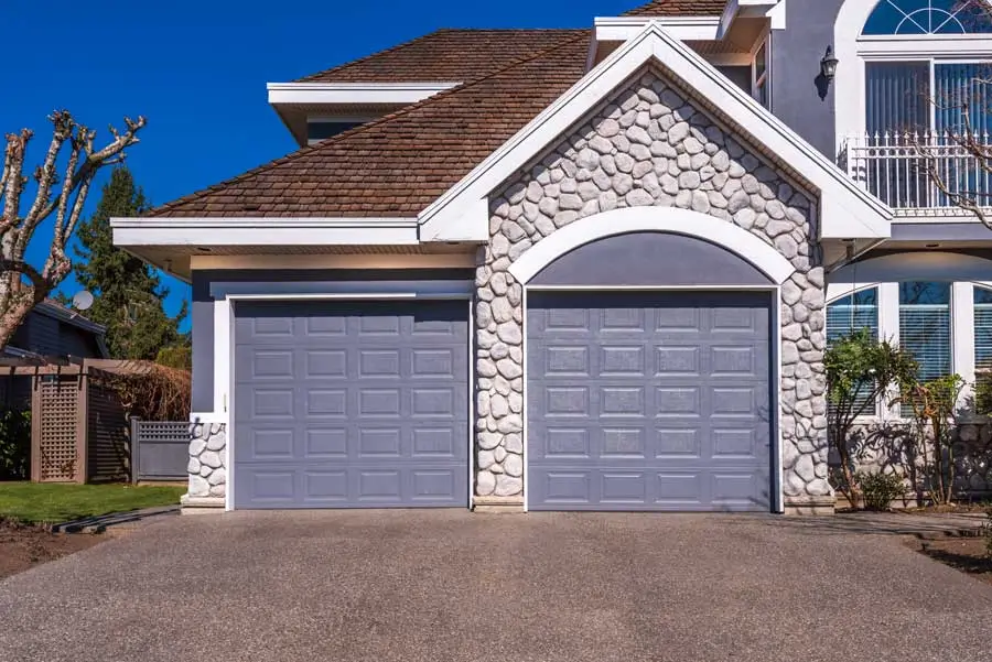 Smart Garage Door Opener Installations Marketing 4 Fragment-of-a-luxury-house-with-a-garage-door-in-v-2026-03-26-10-45-50-utc